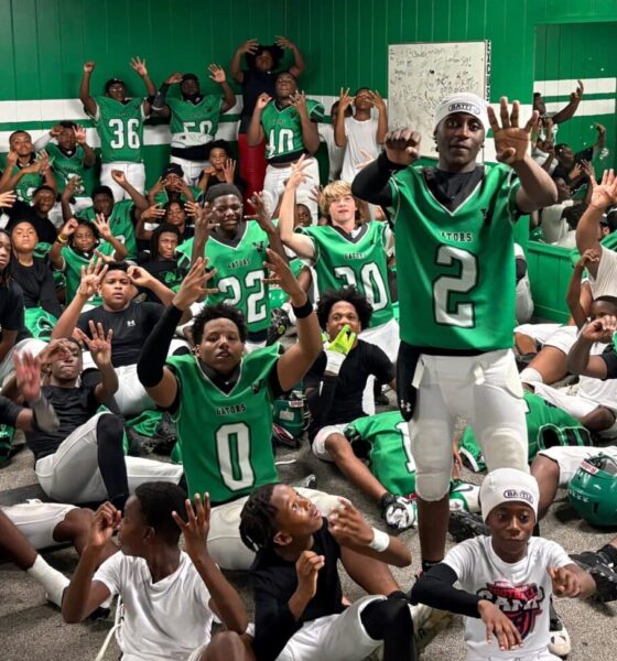 VJHS football team celebrating in locker room after their 4-0 victory, showing team spirit and exci — VJHS improves to 4-0
