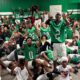 VJHS football team celebrating in locker room after their 4-0 victory, showing team spirit and exci — VJHS improves to 4-0