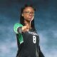 A Vicksburg High School volleyball player in a black jersey points confidently at the came — VHS volleyball defeats Canton