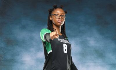 A Vicksburg High School volleyball player in a black jersey points confidently at the came — VHS volleyball defeats Canton