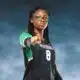 A Vicksburg High School volleyball player in a black jersey points confidently at the came — VHS volleyball defeats Canton