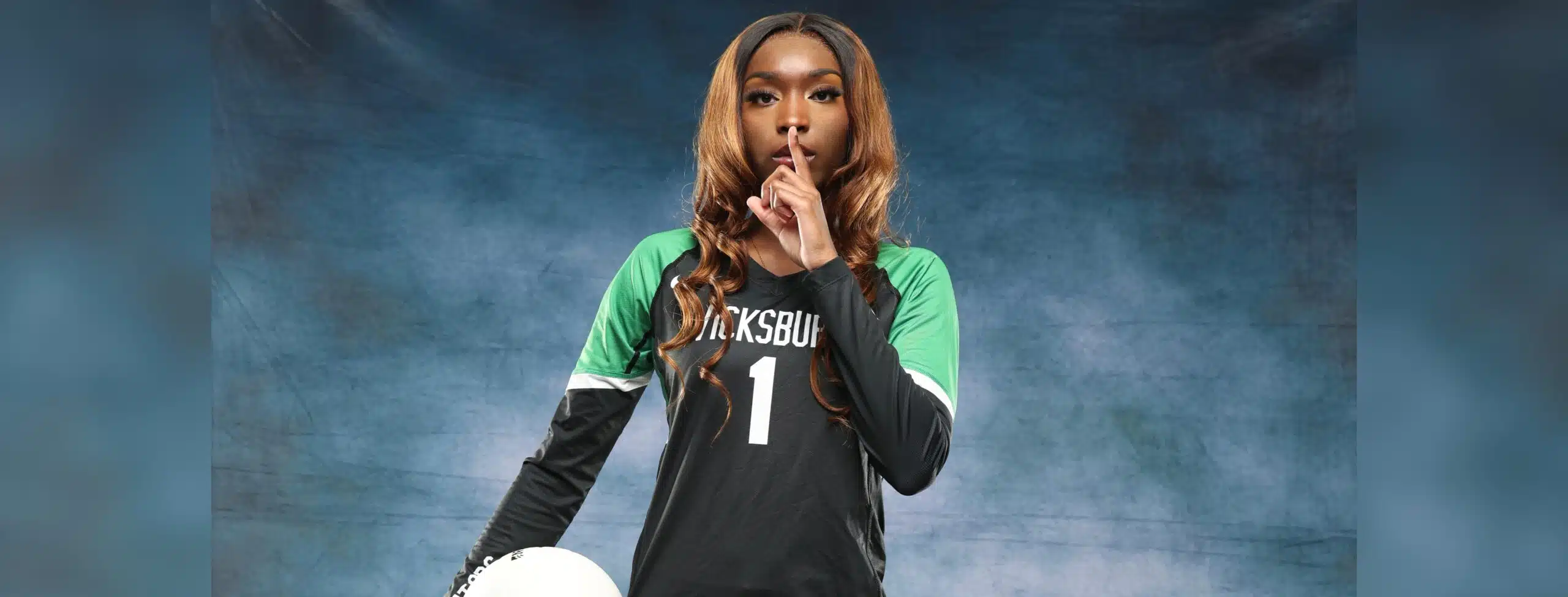 A Vicksburg volleyball player in a black jersey holds a vo — Vicksburg volleyball sweeps Holmes County Central on the road