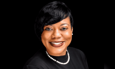 Rashandra Laws, a nurse practitioner, smiling in a professional setting with a black background.