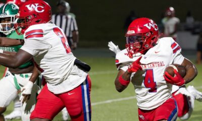 Warren Central football players in red uniforms during a game against Vicksburg High, showcasing action on the fiel — 15th