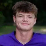 Keller Bradley, a football player in a purple jersey, smiles for the camera outdoors. — Flashes fall to Central Hinds