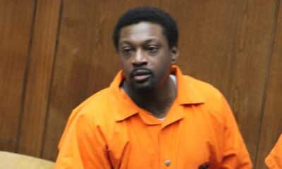 A man in an orange jumpsuit appears in a courtroom setting, looking serious. — $5 million