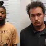 Two men, Kendrick Britton and Justin Cantrell, facing charges related to child sex crimes, standing against a height chart.