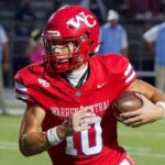 Warren Central quarterback Nash Morgan running with the football during a game against Madison Central.