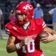 Warren Central quarterback Nash Morgan running with the football during a game against Madison Central.