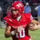 Warren Central quarterback Nash Morgan running with the football during a game against Madison Central.