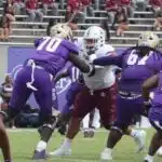 Alcorn State University football players in purple jerseys compete against Tex — Alcorn defeats Texas Southern in overtime