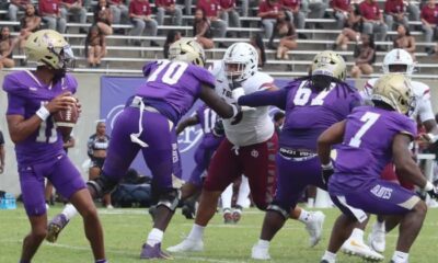 Alcorn State University football players in purple jerseys compete against Tex — Alcorn defeats Texas Southern in overtime