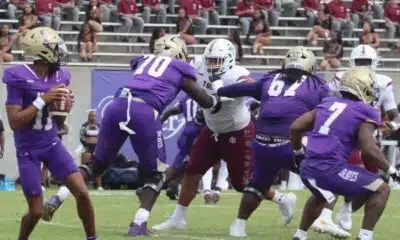 Alcorn State University football players in purple jerseys compete against Tex — Alcorn defeats Texas Southern in overtime