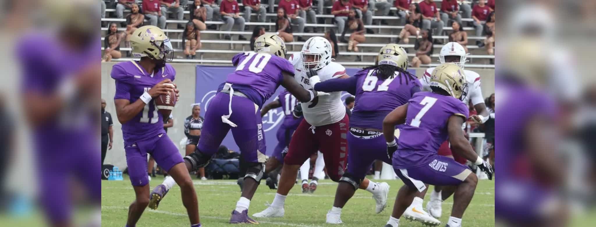 Alcorn State University football players in purple jerseys compete against Tex — Alcorn defeats Texas Southern in overtime