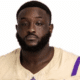 Shardez Taylor in a football uniform, looking serious and confident.