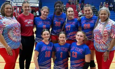 WCJHS volleyball team poses for a group photo in their colorful uniforms — WCJHS volleyball takes two wins over Vicksburg