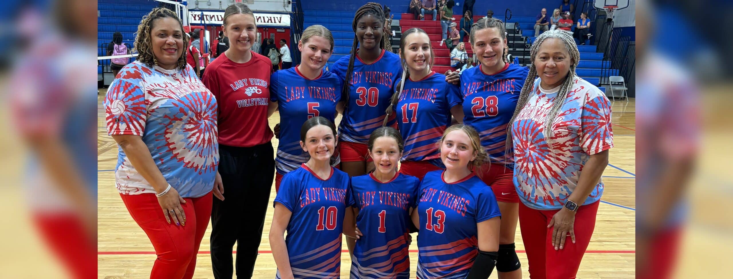 WCJHS volleyball team poses for a group photo in their colorful uniforms — WCJHS volleyball takes two wins over Vicksburg