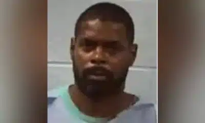 Roosevelt Harris in a gray prison outfit, appearing solemn in a mugshot.