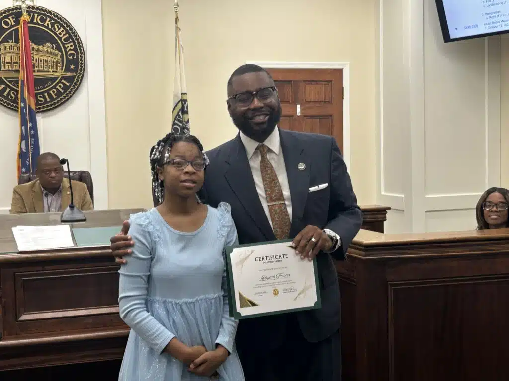 Alderman honors four students