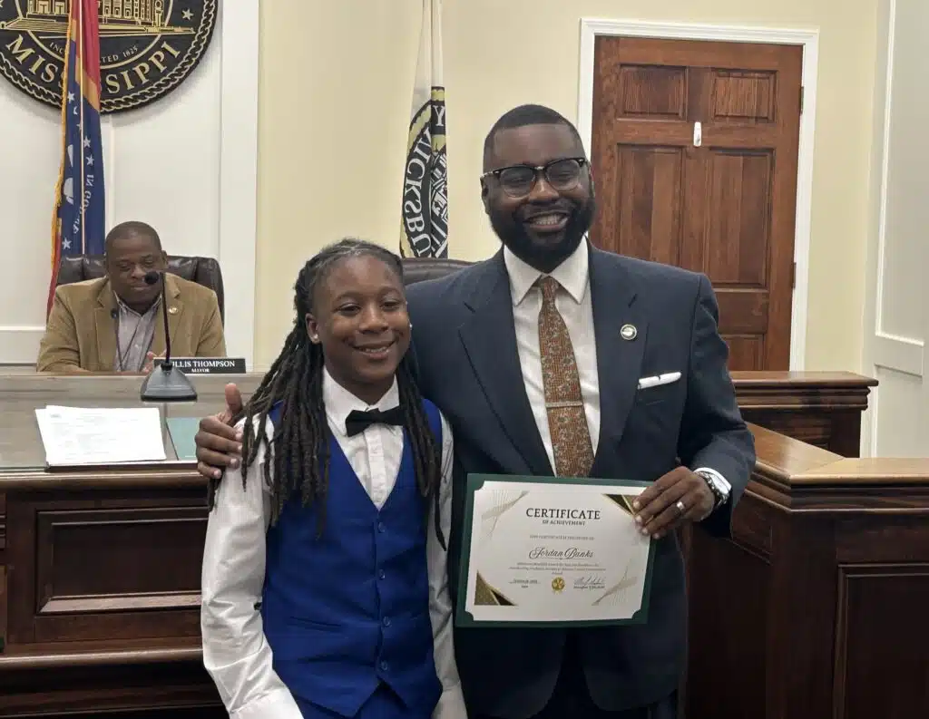 Alderman honors four students
