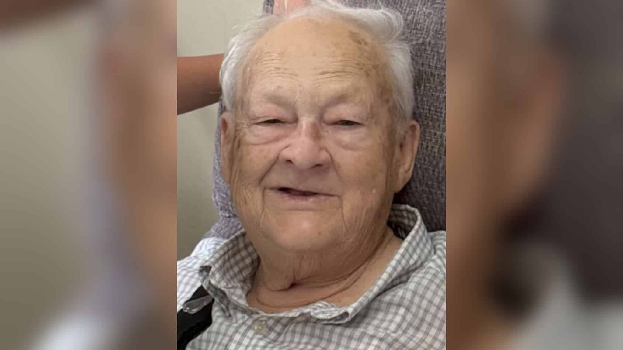 Elderly man with gray hair smiling warmly at the camera. — William