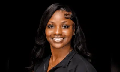 Ty’Kerria Henderson, a family medicine provider, smiles confidently in a professional setting.