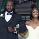 A smiling young woman in a white gown is escorted by a man in a tuxedo at homecoming, part of — 1 million views homecoming