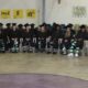 Graduates in caps and gowns sit in a row at — 25 incarcerated women graduate from programs at Delta Correctional Facility