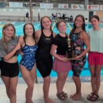 Warren Central girls swim team celebrating their North State championship win at De — Warren Central wins North State swim