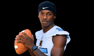 A football player in a blue and white jersey poses confidently with a football — Port Gibson defeats Franklin County 30-21