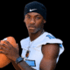 A football player in a blue and white jersey poses confidently with a football — Port Gibson defeats Franklin County 30-21