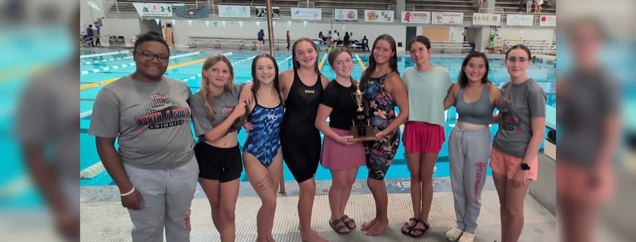 Warren Central girls swim team celebrating their North State championship win at De — Warren Central wins North State swim