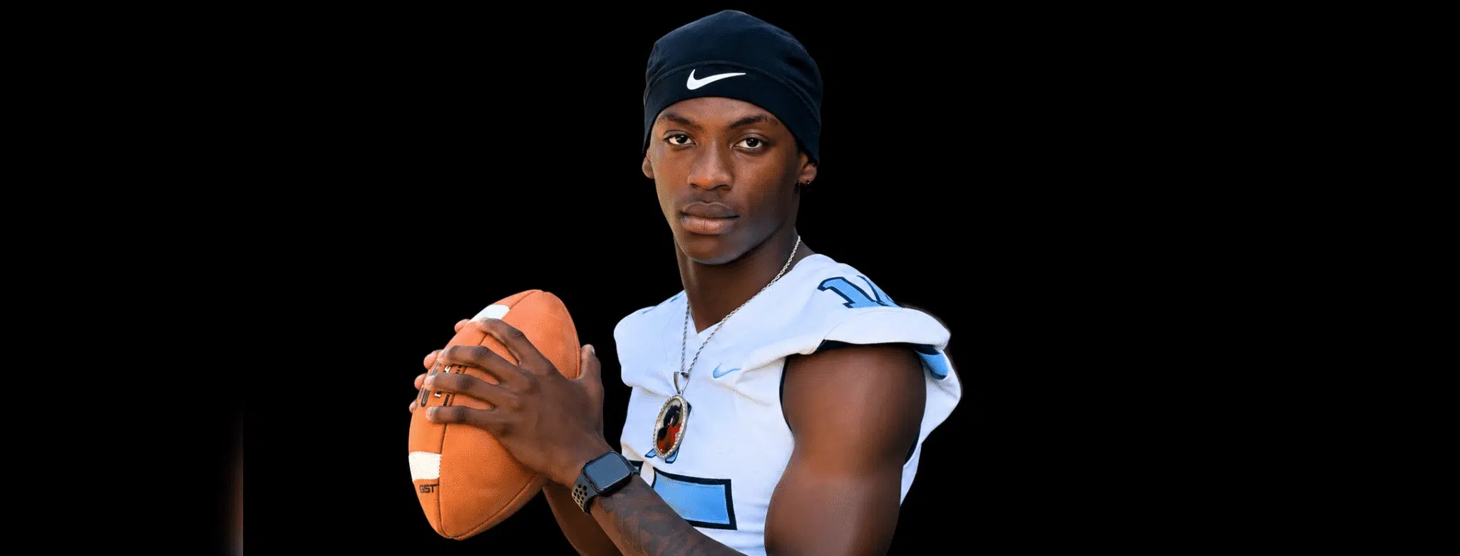 A football player in a blue and white jersey poses confidently with a football — Port Gibson defeats Franklin County 30-21