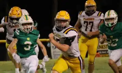 A St. Aloysius Junior High football player runs — St. Aloysius Junior High dominates Central Hinds 28-0 for third shutout