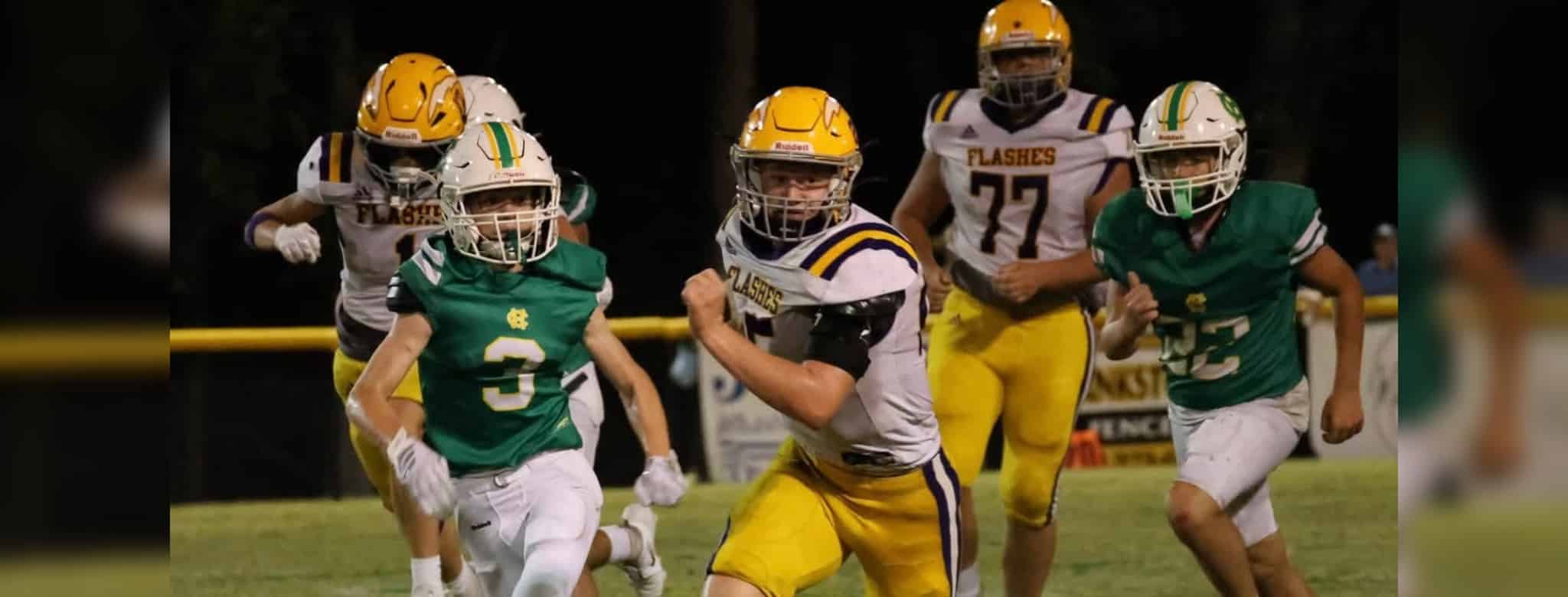 A St. Aloysius Junior High football player runs — St. Aloysius Junior High dominates Central Hinds 28-0 for third shutout