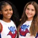 Two young cheerleaders smiling, wearing cheer uniforms with a Viking logo, celebrating their roles as cheer captains.