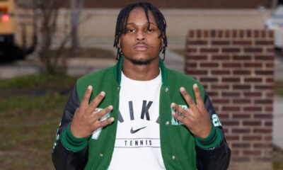 Wallyss Curry, a Vicksburg High School linebacker, shows four fingers while wearing a green an — Wallyss Curry 100 tackles