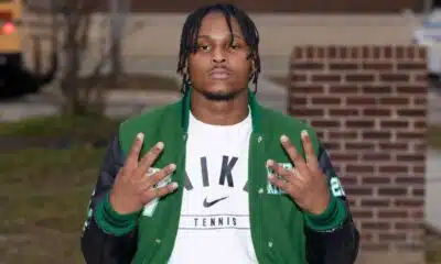 Wallyss Curry, a Vicksburg High School linebacker, shows four fingers while wearing a green an — Wallyss Curry 100 tackles