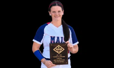 Hallie Grace Malone holding her MAIS All-Star Game MVP plaque, wearing a softball uniform.