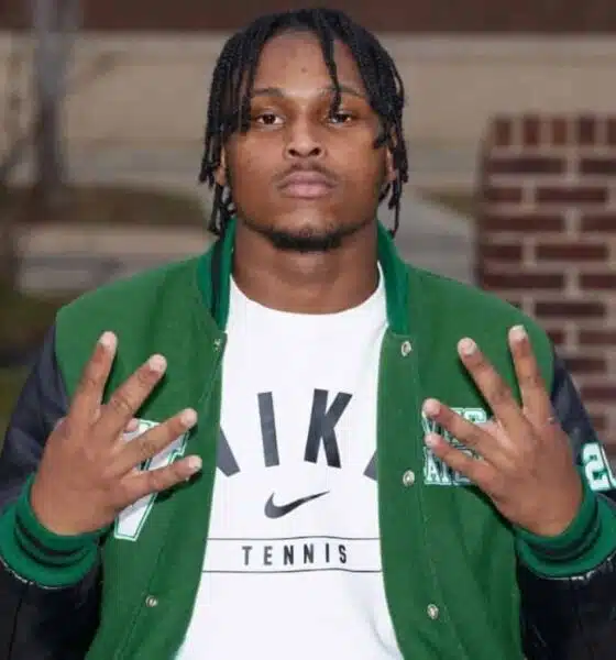Wallyss Curry, a Vicksburg High School linebacker, shows four fingers while wearing a green an — Wallyss Curry 100 tackles