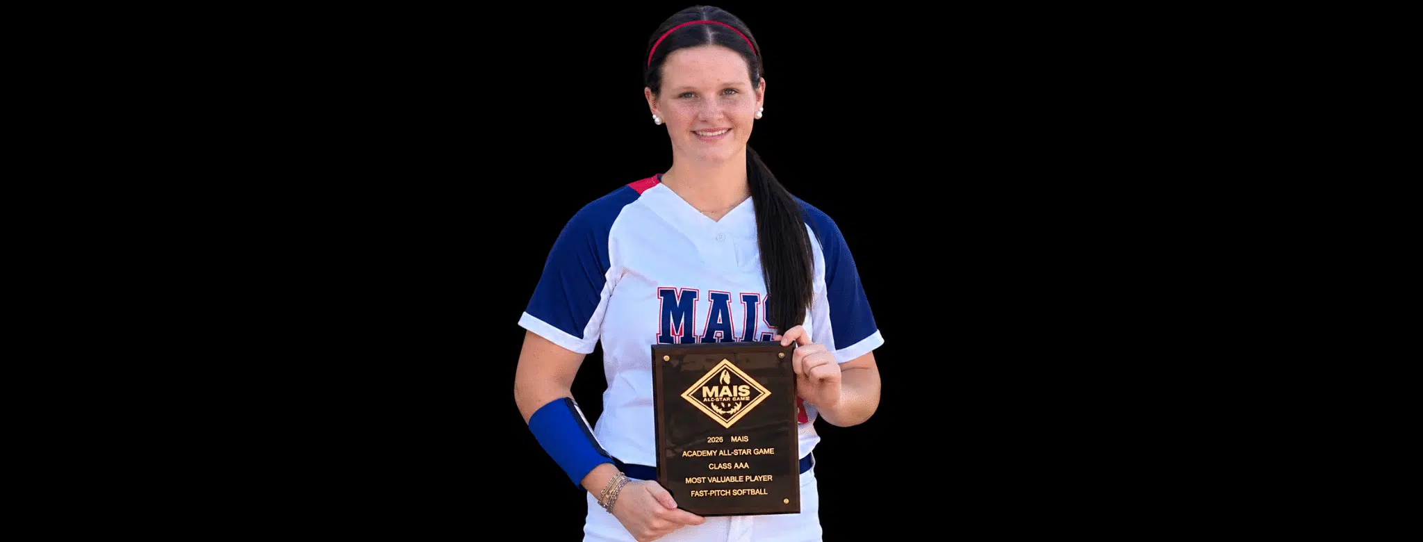 Hallie Grace Malone holding her MAIS All-Star Game MVP plaque, wearing a softball uniform.