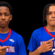 Gayvin Turner and Mason Truly in blue Warren Central basketball jerseys, pointing toward their uniforms.