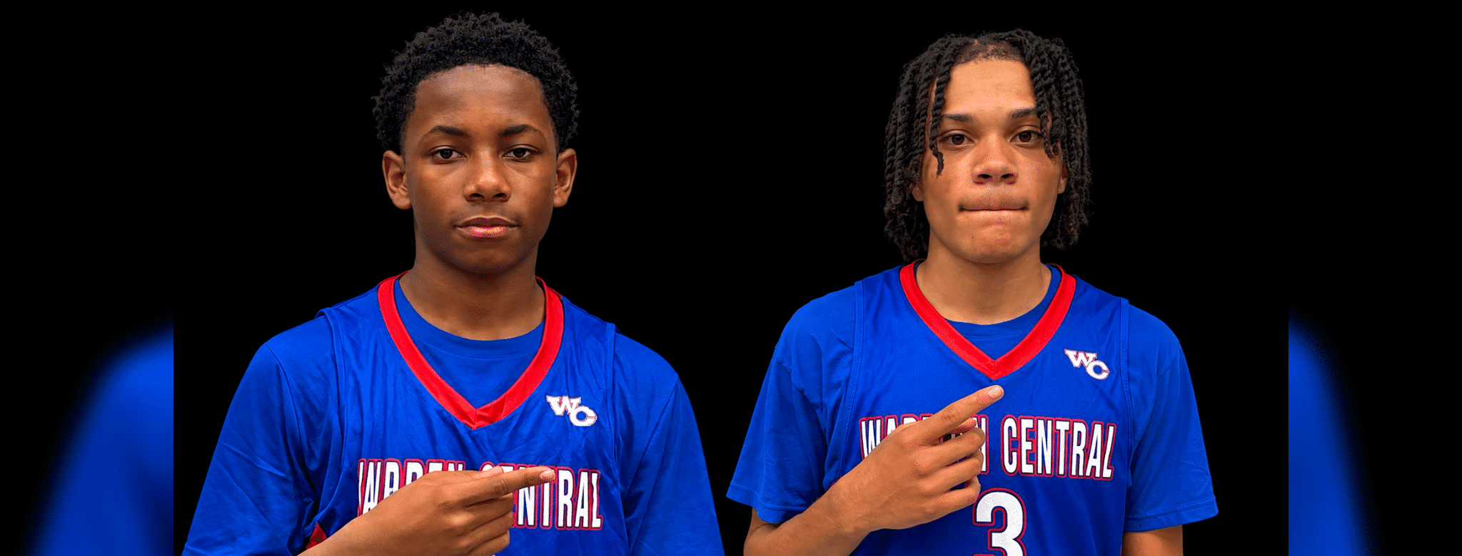 Gayvin Turner and Mason Truly in blue Warren Central basketball jerseys, pointing toward their uniforms.