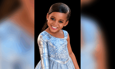 Portrait of Paris Morris Jones smiling in a light blue, sparkling dress