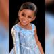 Portrait of Paris Morris Jones smiling in a light blue, sparkling dress