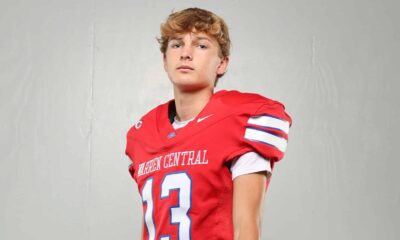 Warren Central High School kicker Nick Lee in a red football uniform, posing confidently against a plain background.