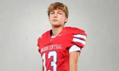 Warren Central High School kicker Nick Lee in a red football uniform, posing confidently against a plain background.