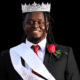 Mason Watts wearing a crown and sash, smiling proudly at his Homecoming King coronation. — Mason Watts homecoming king