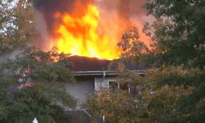 Flames and smoke rise from the roof of an assisted — Two Vicksburg natives killed in Clinton assisted living facility fire