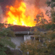 Flames and smoke rise from the roof of an assisted — Two Vicksburg natives killed in Clinton assisted living facility fire